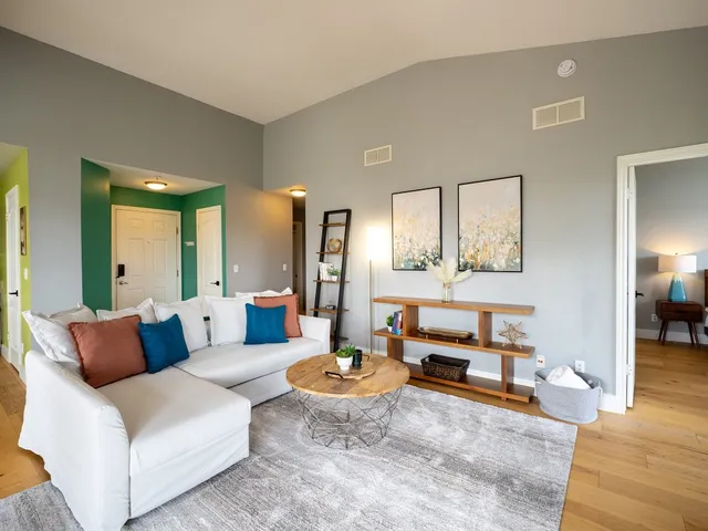 a living room with furniture and a table