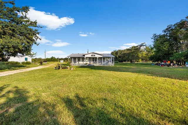 a view of an ocean house with a big yard