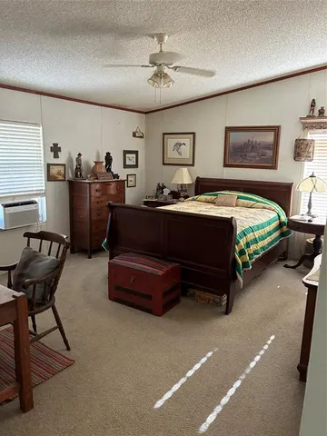 a bed room with furniture and a chair