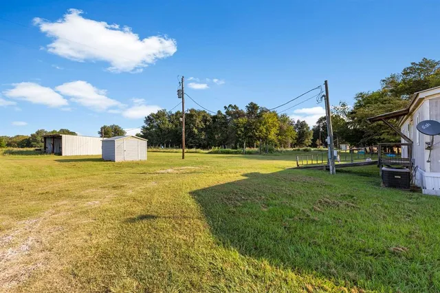 a view of a house with a big yard