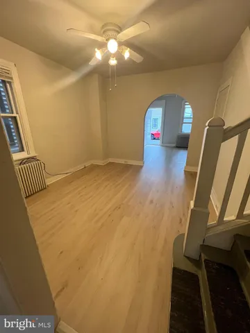 a view of staircase with wooden floor