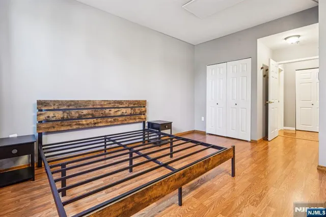 a view of a room with wooden floor