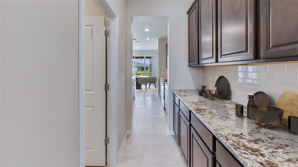 1913 Cobb Trail Parrish, FL 34219 - Photo 5 of 17 a kitchen with granite countertop stainless steel appliances and sink
