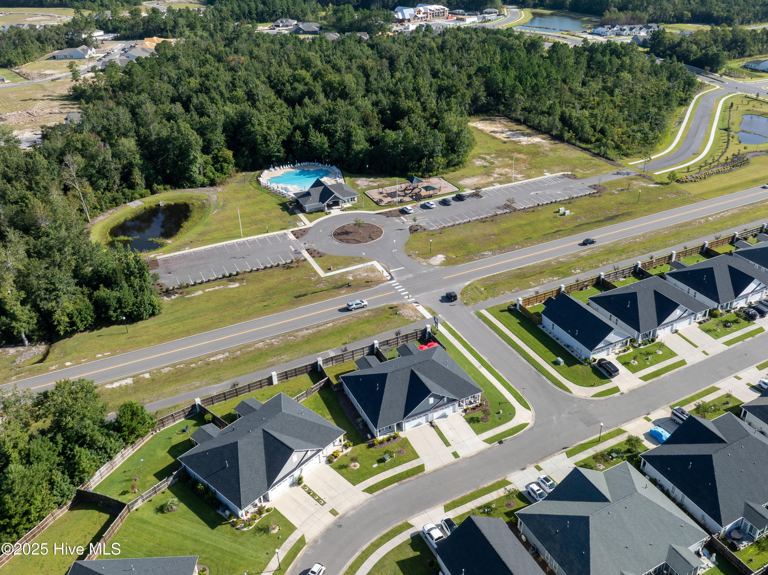 6484 Pinnacle Point Winnabow, NC 28479 - Photo 33 of 36 Zoom out photos of street in relation to the pool and clubhouse.