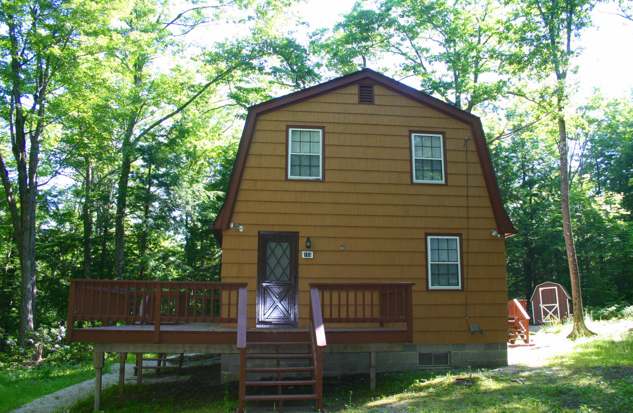 153 Stanley Road Otis, MA 01029 - Photo 2 of 19 a front view of a house with garden