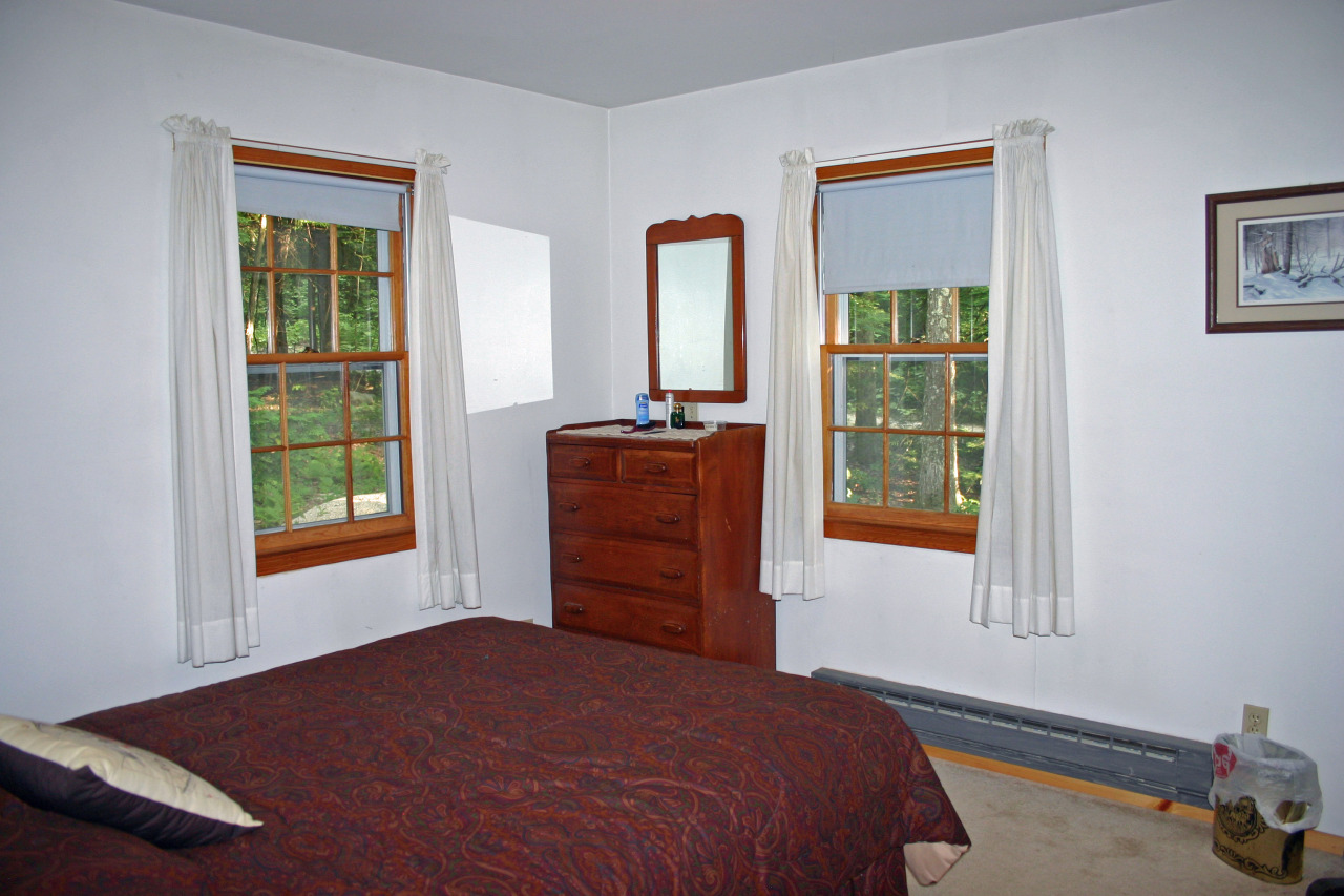 153 Stanley Road Otis, MA 01029 - Photo 3 of 19 a bedroom with a bed and a window