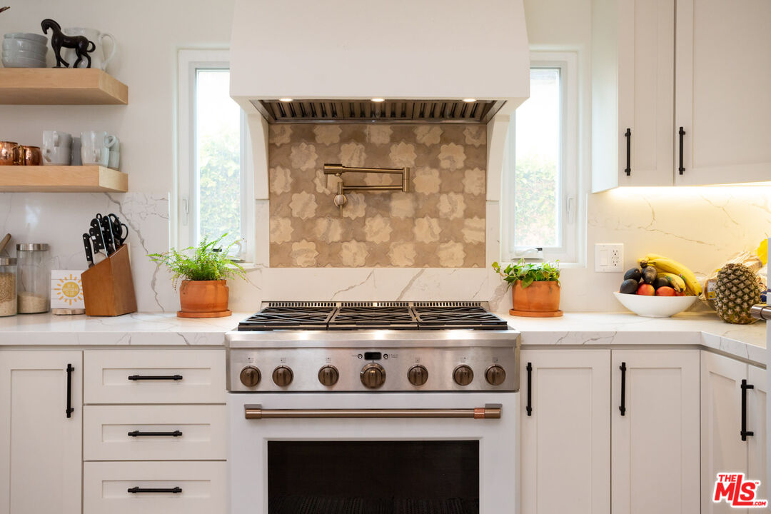 7137 Trask Avenue Playa del Rey, CA 90293 - Photo 13 of 46 a stove top oven sitting inside of a kitchen