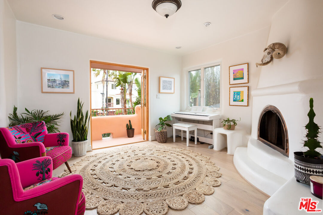 7137 Trask Avenue Playa del Rey, CA 90293 - Photo 14 of 46 a living room with furniture a window and a fireplace