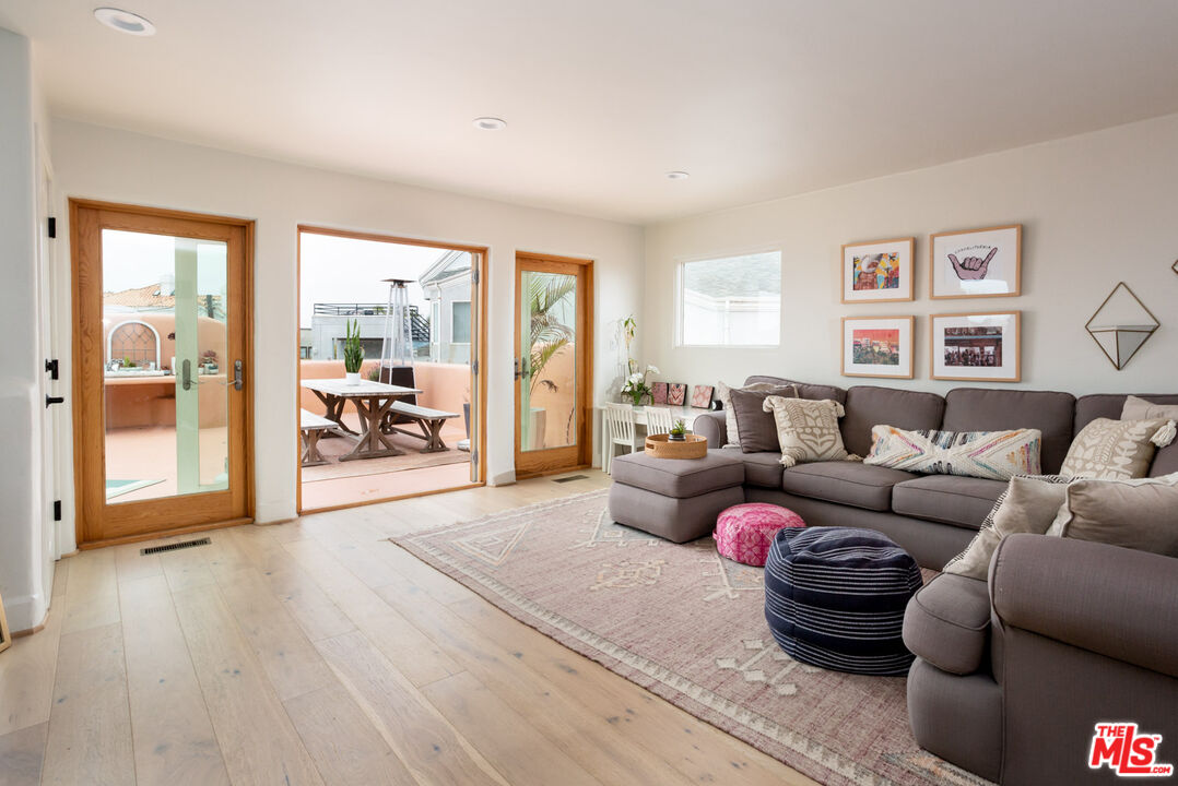 7137 Trask Avenue Playa del Rey, CA 90293 - Photo 30 of 46 a living room with furniture and a wooden floor
