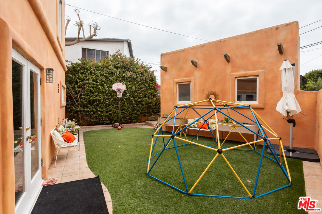 7137 Trask Avenue Playa del Rey, CA 90293 - Photo 34 of 46 a view of a backyard with table and chairs and potted plants