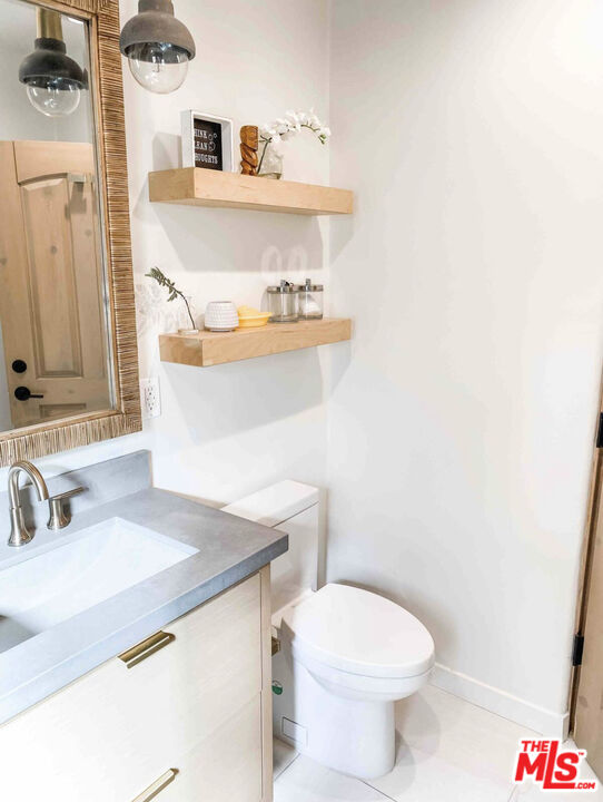 7137 Trask Avenue Playa del Rey, CA 90293 - Photo 41 of 46 a bathroom with a sink a toilet and a mirror