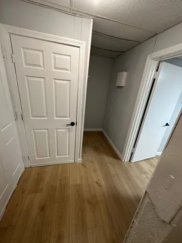 an empty room with wooden floor