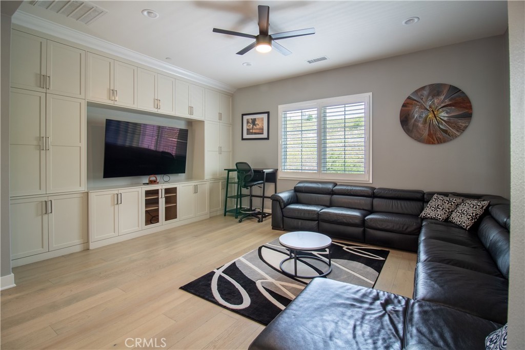 51 Egret Irvine, CA 92618 - Photo 15 of 24 a living room with furniture a flat screen tv and kitchen view