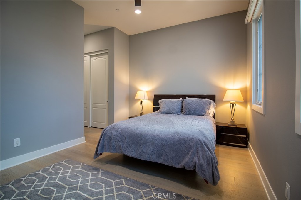 51 Egret Irvine, CA 92618 - Photo 17 of 24 a bedroom with a bed and a night stand