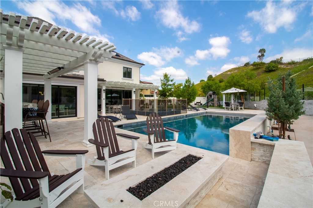 51 Egret Irvine, CA 92618 - Photo 22 of 24 a view of a swimming pool with outdoor seating and plants