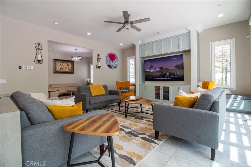 51 Egret Irvine, CA 92618 - Photo 10 of 24 a living room with furniture kitchen view and a flat screen tv