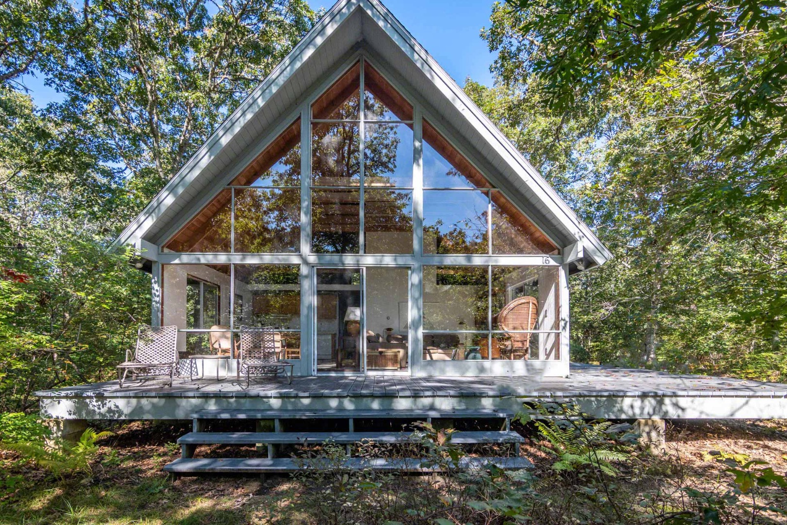 16 Kent Harbor Road Edgartown, MA 02539 - Photo 3 of 35 a view of house with a large window and wooden fence