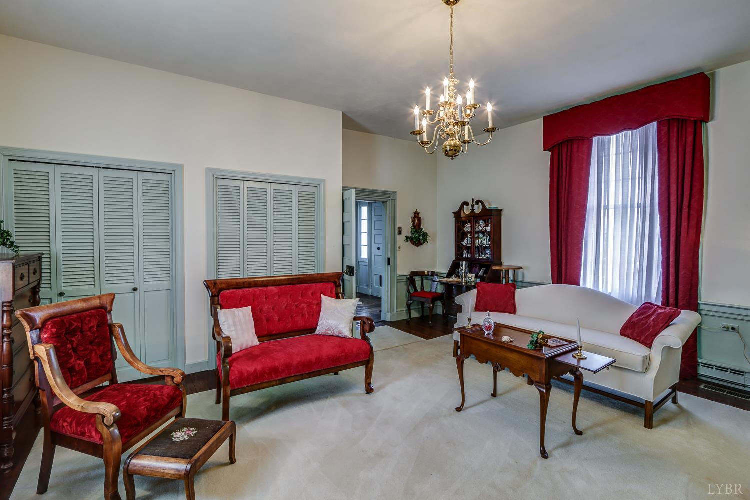 129 Lawyers Road Red House, VA 23963 - Photo 17 of 72 a living room with furniture and a chandelier