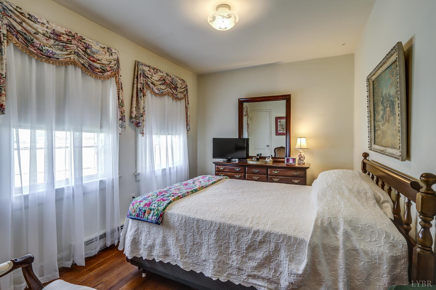 129 Lawyers Road Red House, VA 23963 - Photo 26 of 72 a bedroom with a bed and wooden floor
