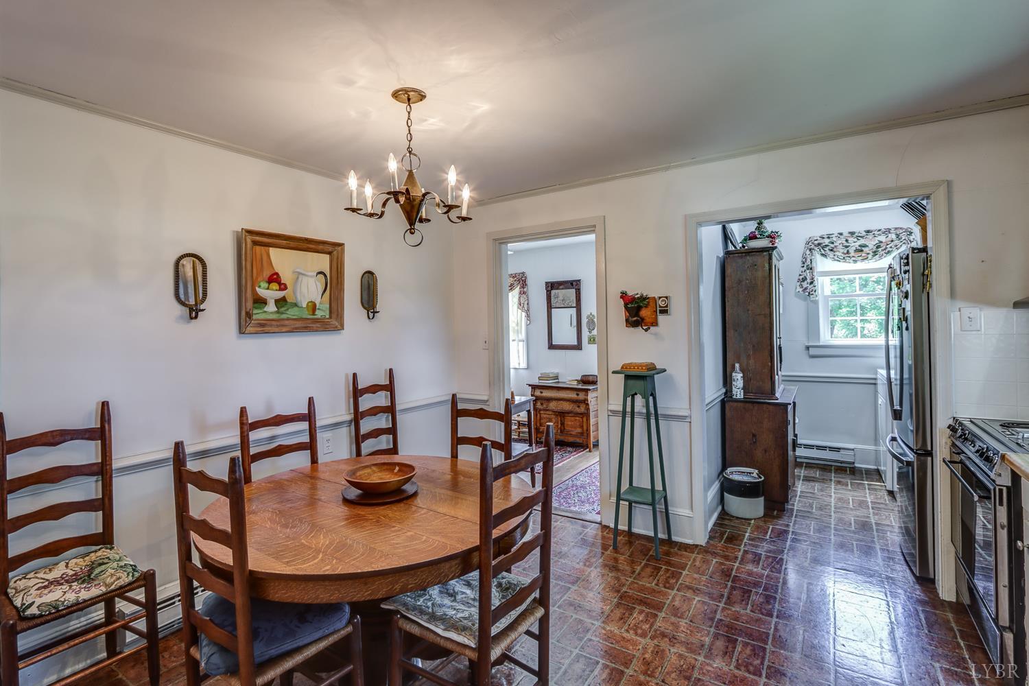 129 Lawyers Road Red House, VA 23963 - Photo 28 of 72 a view of a dining room with furniture a chandelier and wooden floor