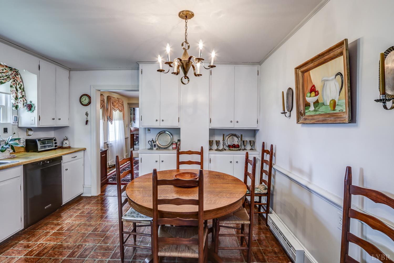 129 Lawyers Road Red House, VA 23963 - Photo 30 of 72 a view of a dining room with furniture and chandelier