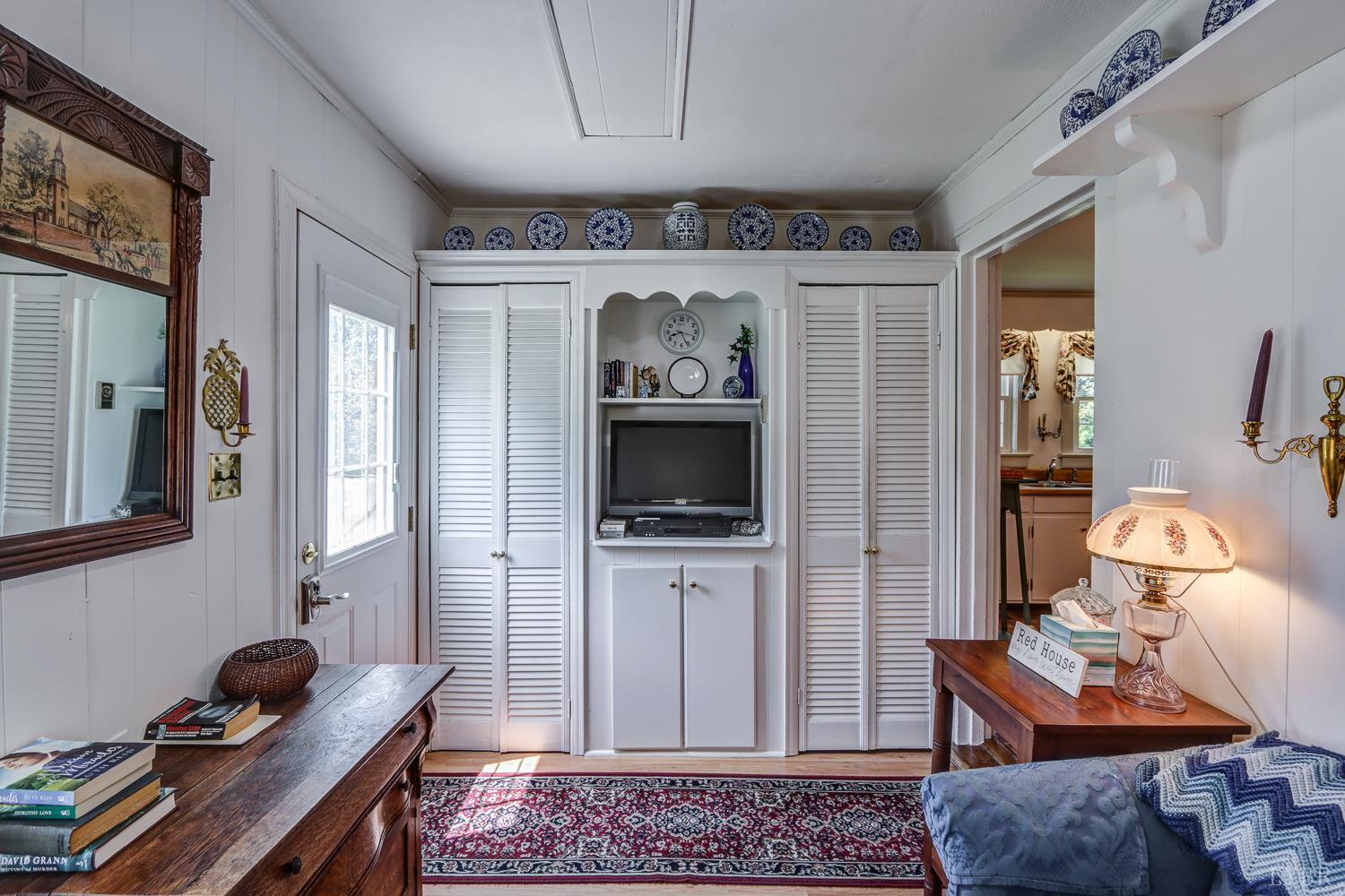 129 Lawyers Road Red House, VA 23963 - Photo 38 of 72 a living room with furniture and a flat screen tv