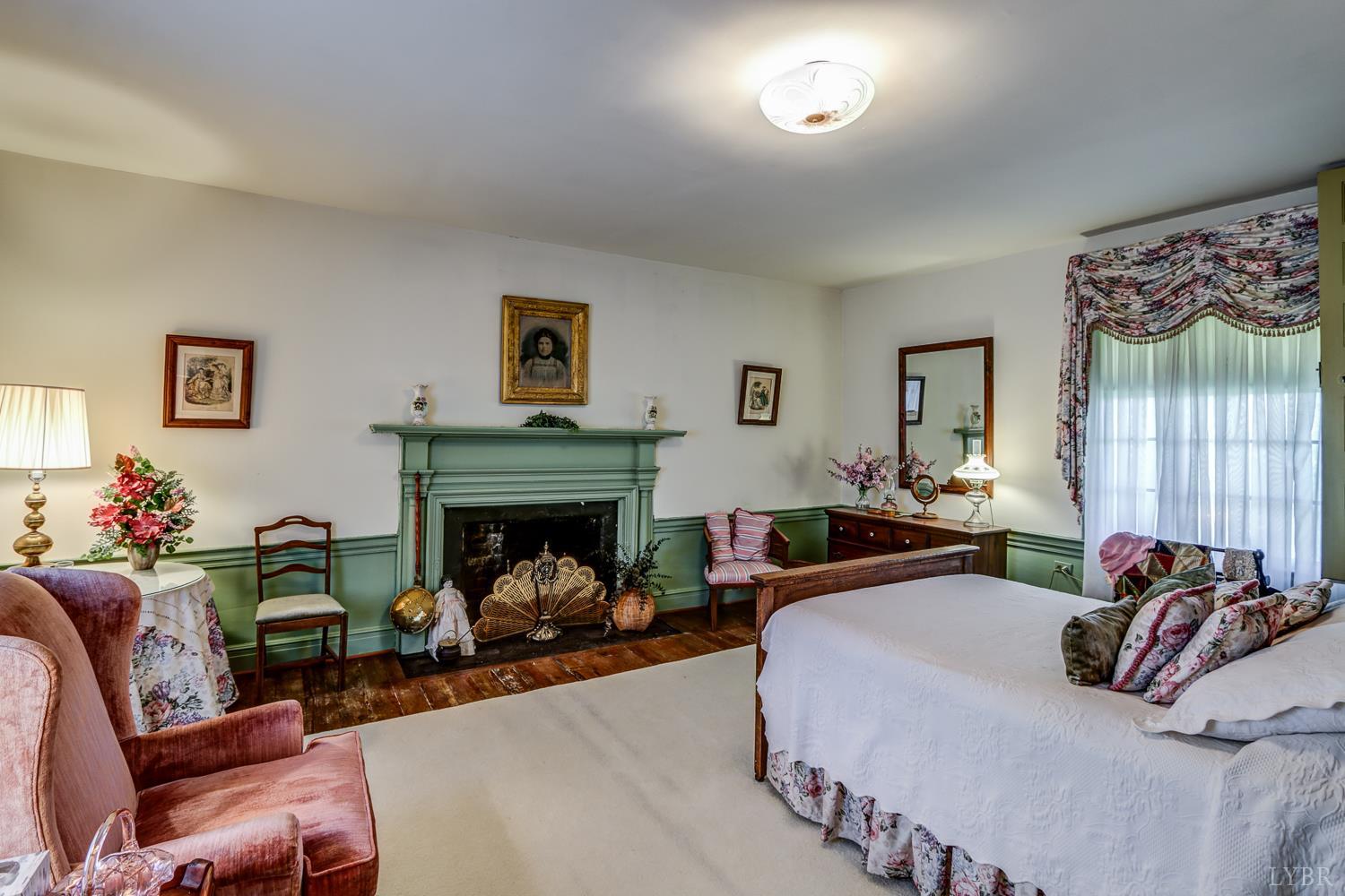 129 Lawyers Road Red House, VA 23963 - Photo 48 of 72 a bedroom with furniture and a fireplace
