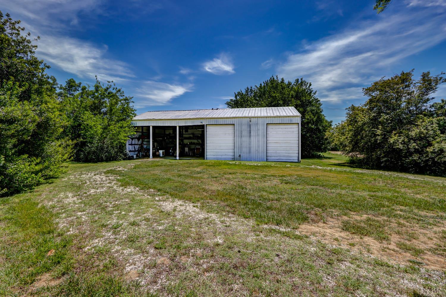 129 Lawyers Road Red House, VA 23963 - Photo 58 of 72 a house with huge green field in front of it