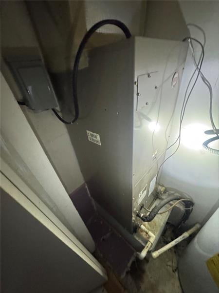 4707 Mariners Drive Stone Mountain, GA 30083 - Photo 11 of 25 a room with water heater and wooden floor