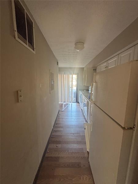 4707 Mariners Drive Stone Mountain, GA 30083 - Photo 19 of 25 a view of a hallway with the wooden floor