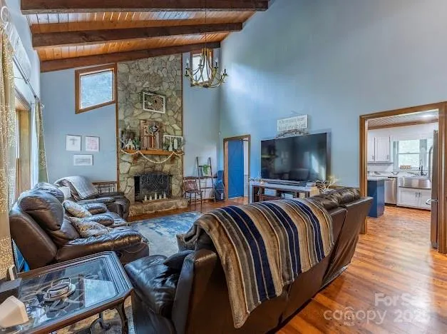 a living room with furniture fireplace and flat screen tv