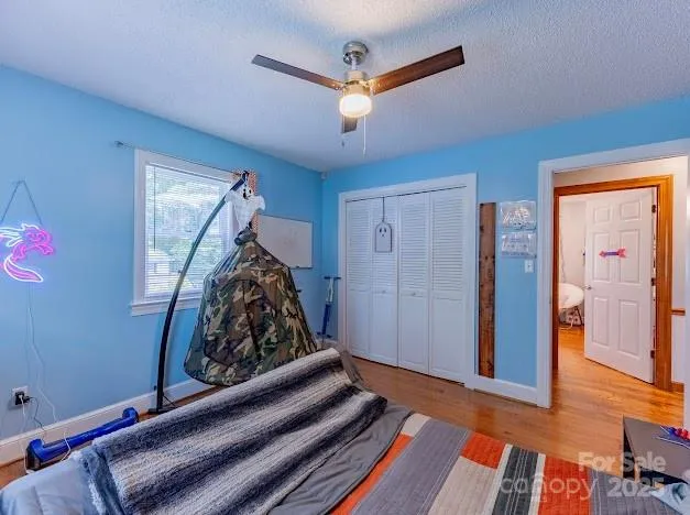 a bed room with a bed and a window