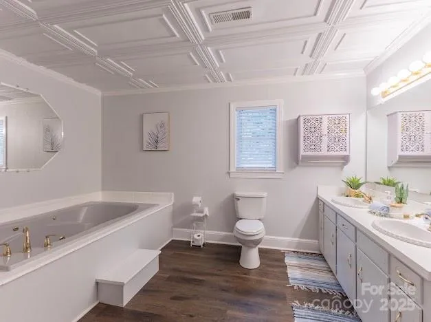 a bathroom with a sink toilet a mirror and bathtub