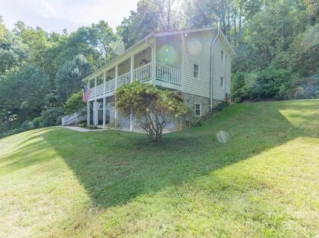 a view of a house with a yard