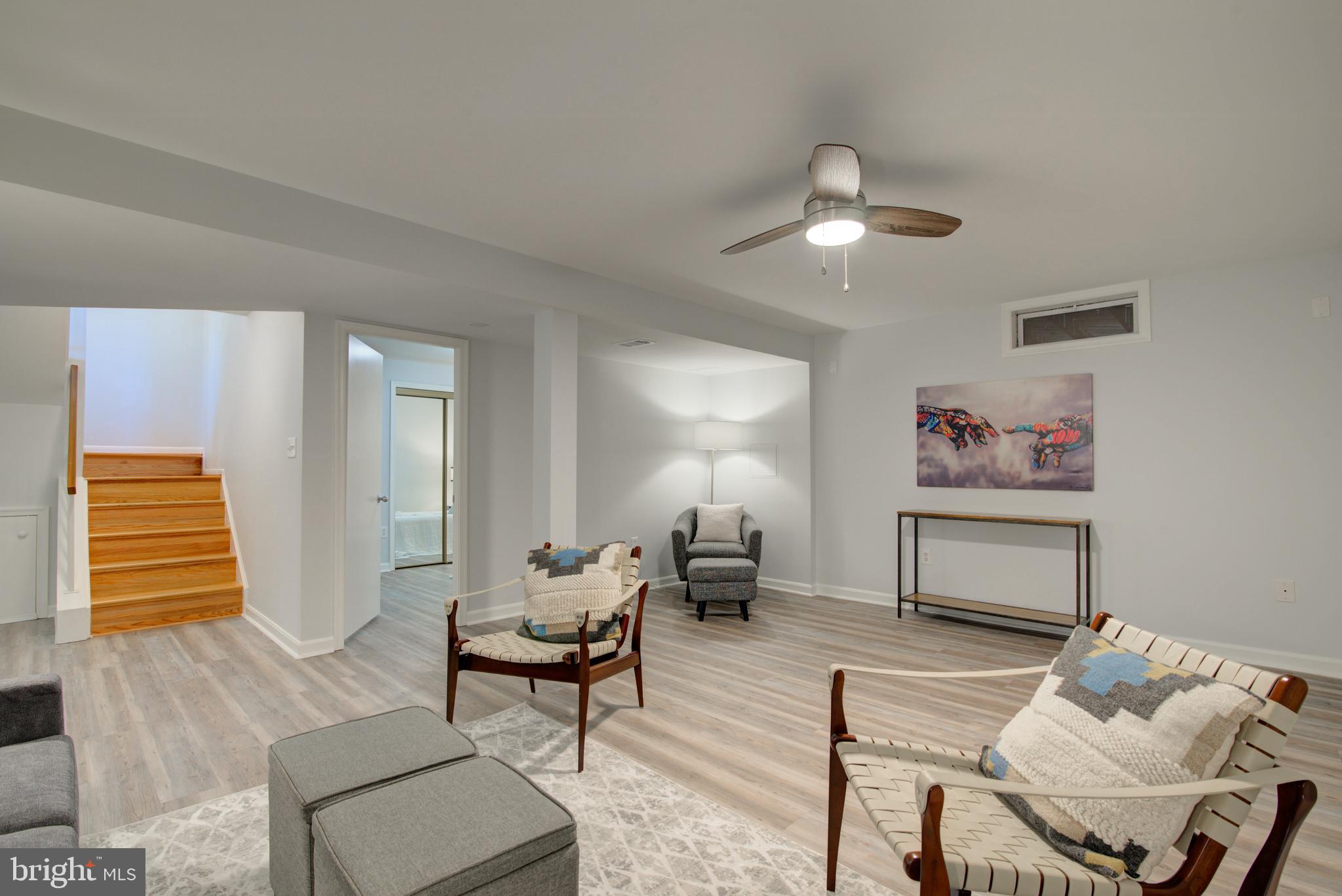 11619 Chapel Cross Way Reston, VA 20194 - Photo 23 of 33 Lower Level Recreation Room w/Luxury Vinyl Plank