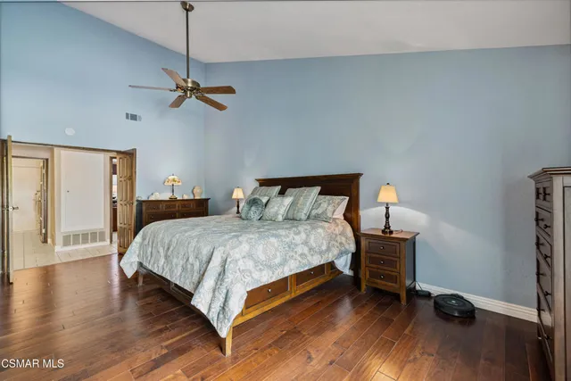 a bedroom with a bed and a dresser