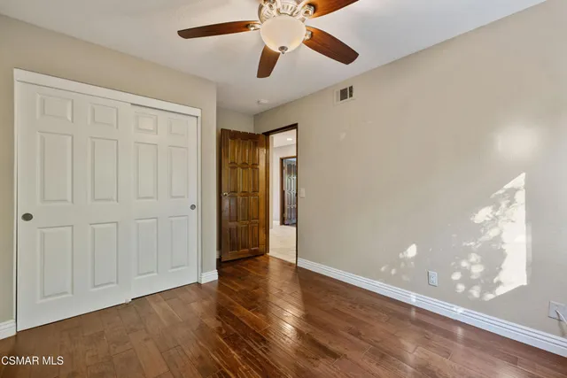 a bed room with a bed and a window