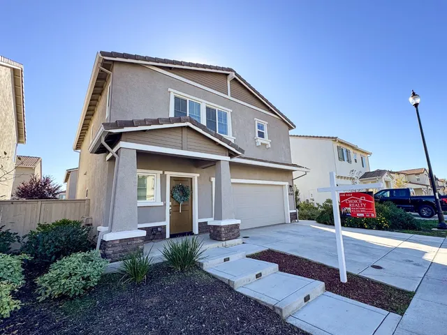 a front view of a house with a porch