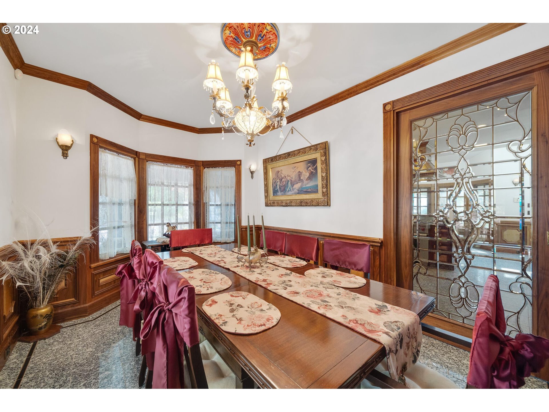 11250 Whiskey Creek Road Tillamook, OR 97141 - Photo 14 of 48 a view of a dining room with furniture a chandelier and wooden floor