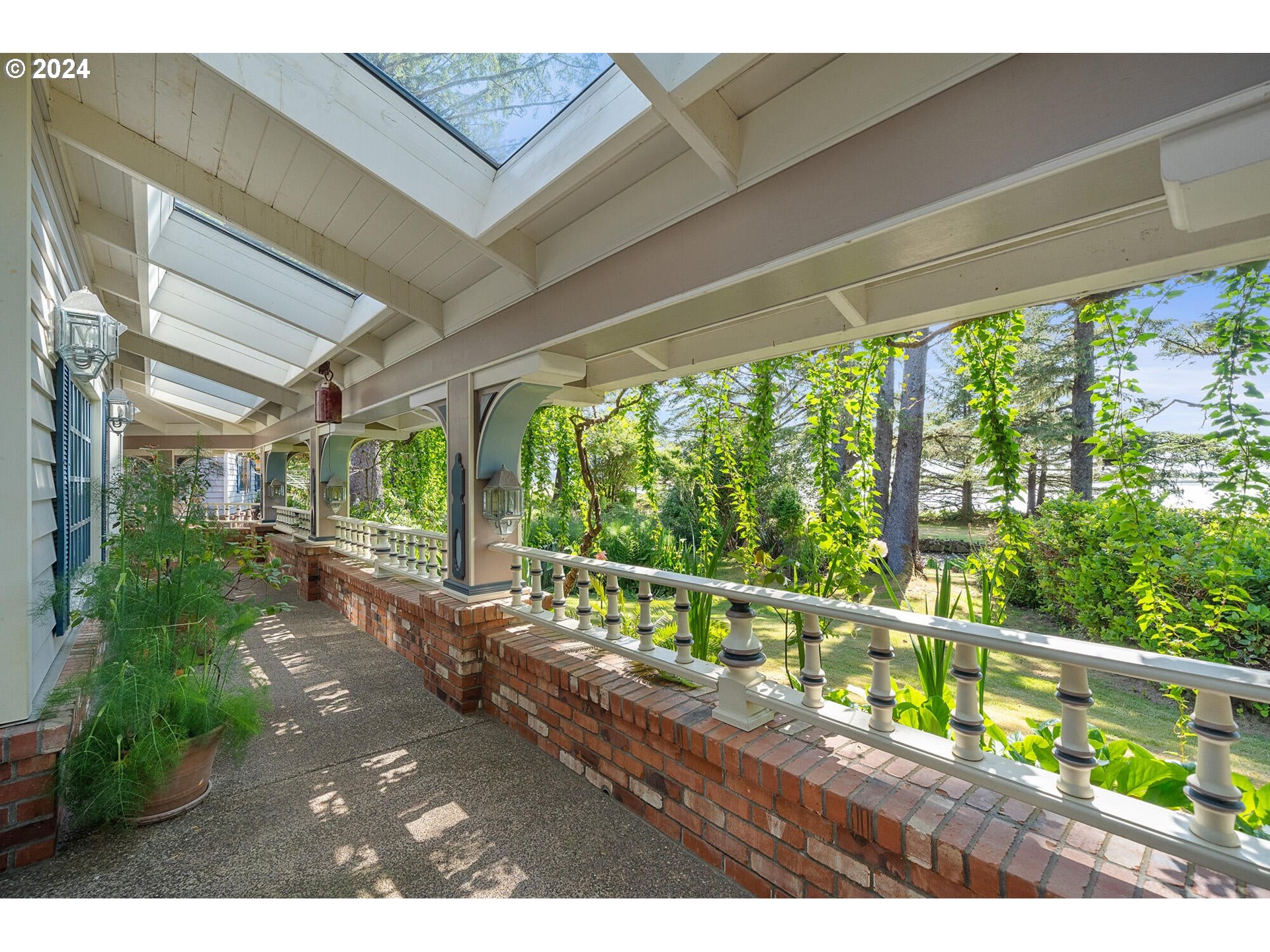 11250 Whiskey Creek Road Tillamook, OR 97141 - Photo 16 of 48 a view of a porch with furniture and garden