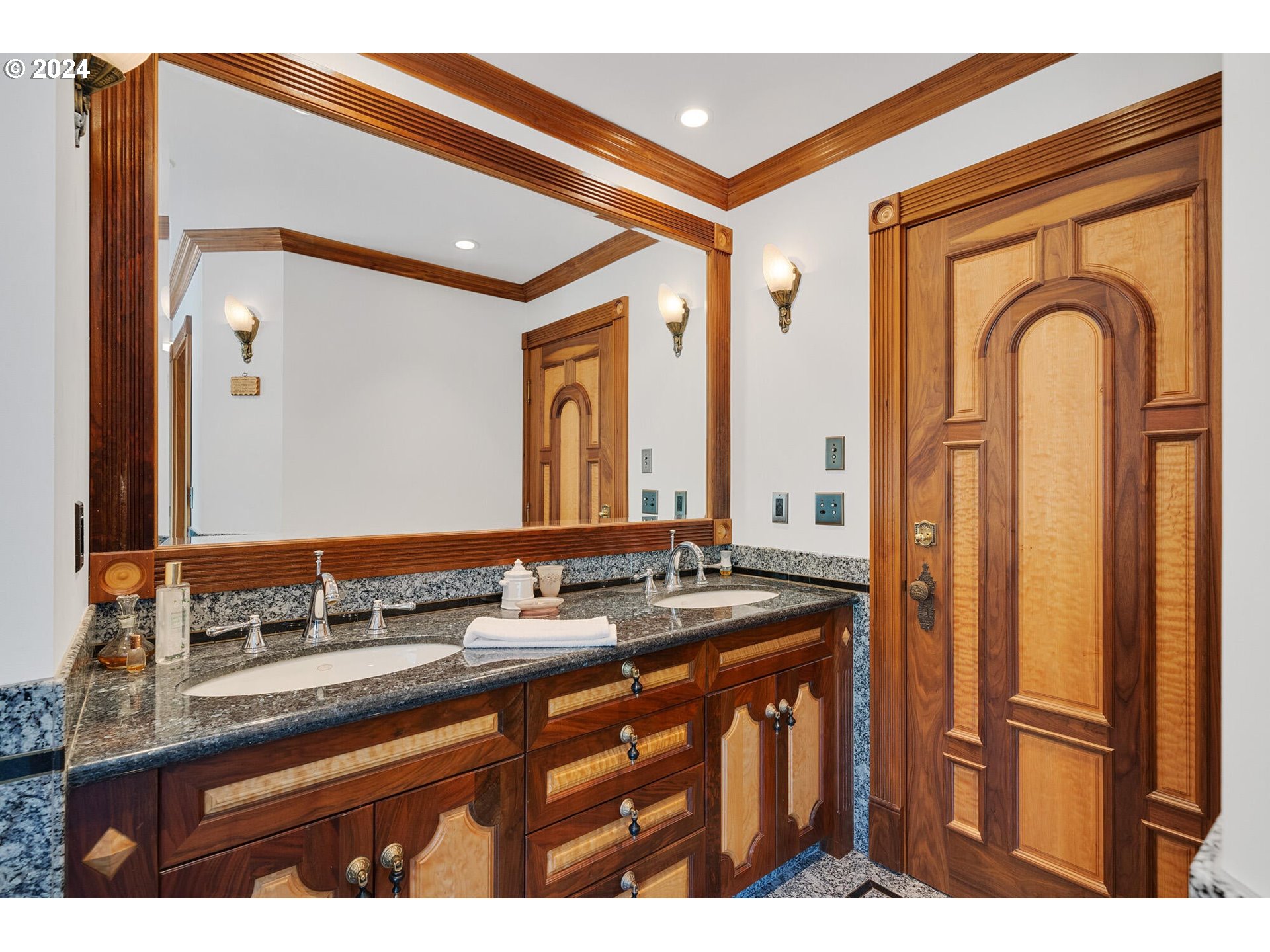 11250 Whiskey Creek Road Tillamook, OR 97141 - Photo 23 of 48 a bathroom with a granite countertop sink a mirror and a shower