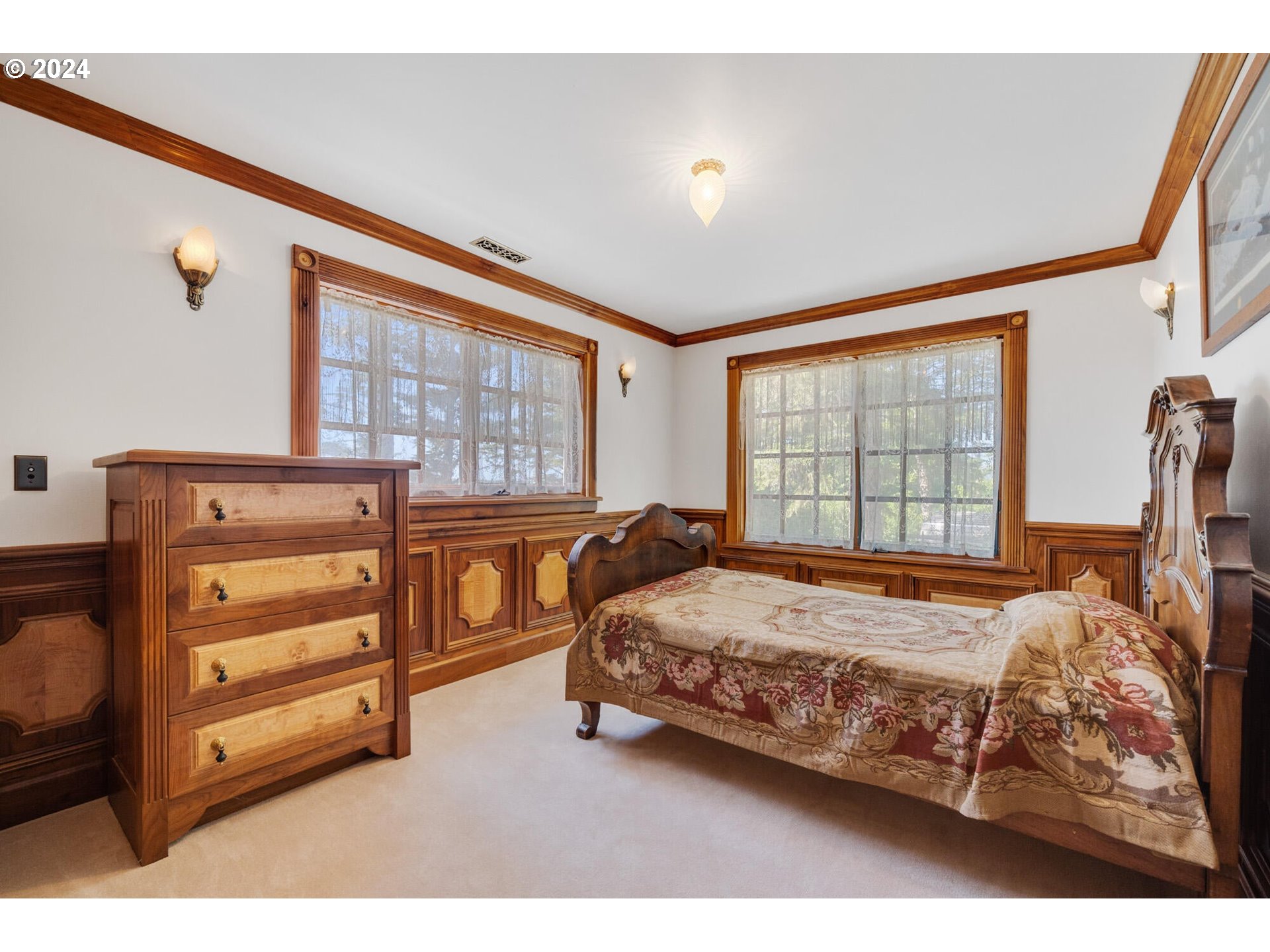11250 Whiskey Creek Road Tillamook, OR 97141 - Photo 27 of 48 a bedroom with a bed and a window