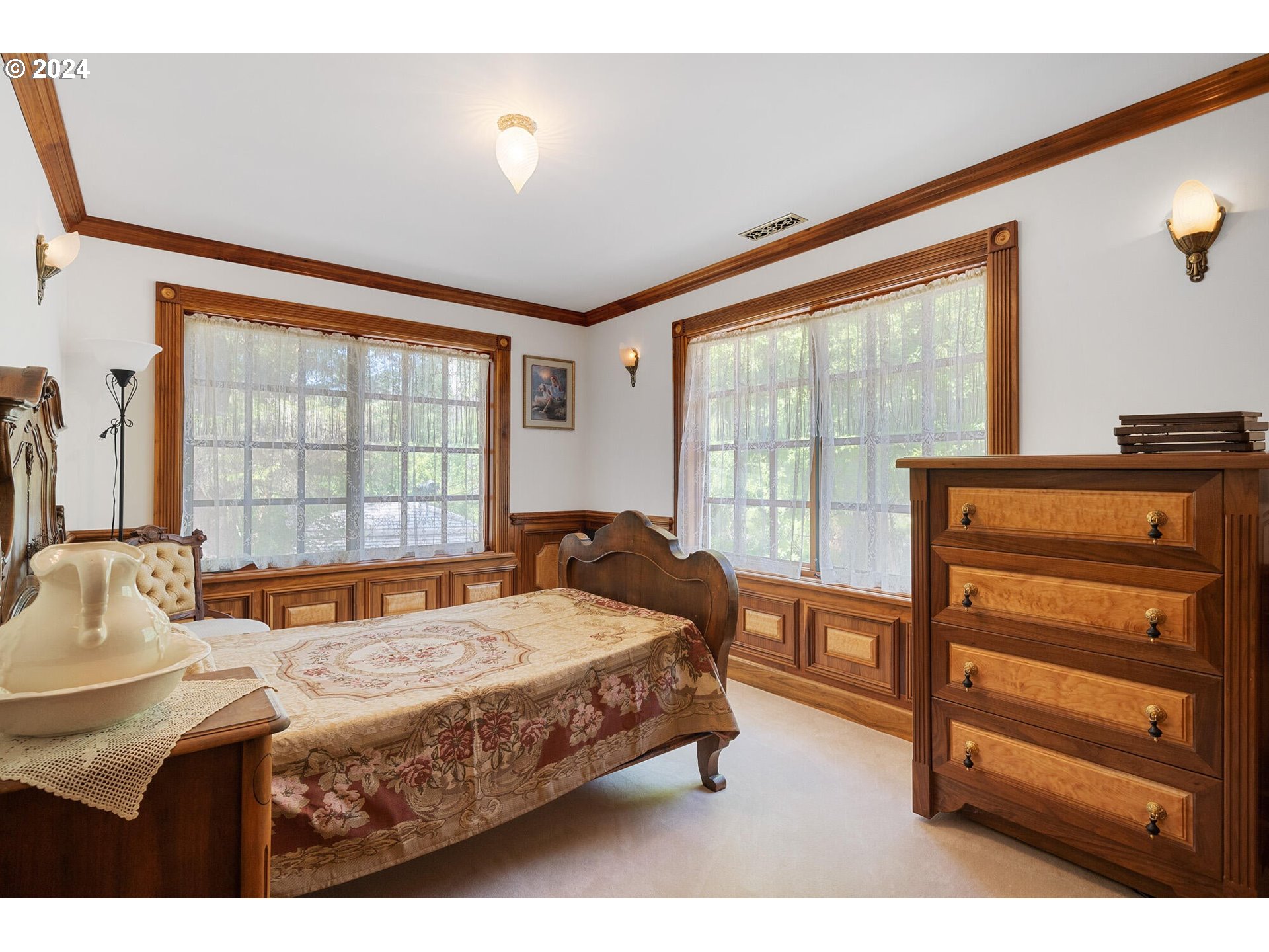 11250 Whiskey Creek Road Tillamook, OR 97141 - Photo 30 of 48 a bedroom with a bed and a window