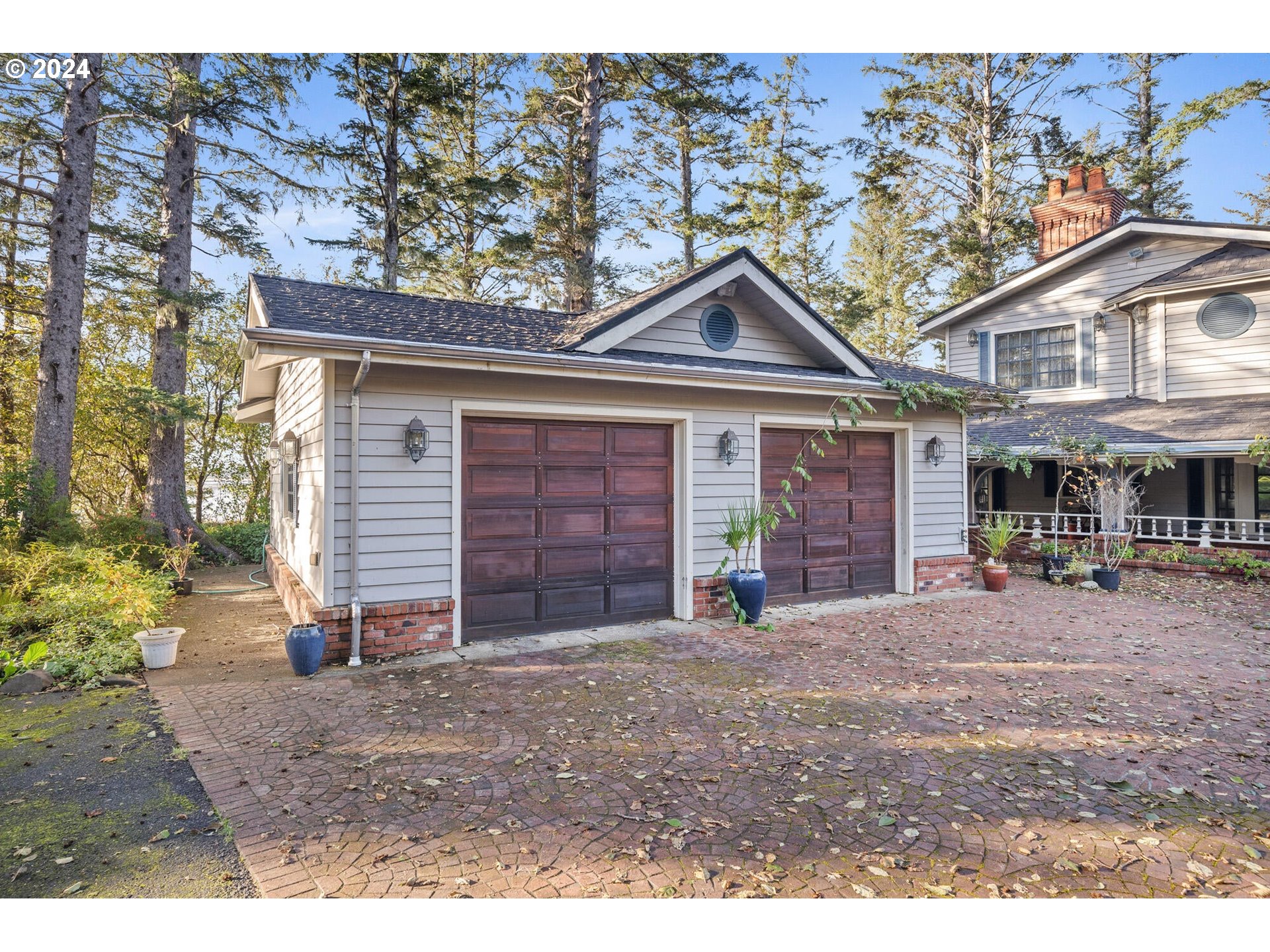 11250 Whiskey Creek Road Tillamook, OR 97141 - Photo 35 of 48 a front view of a house with garden
