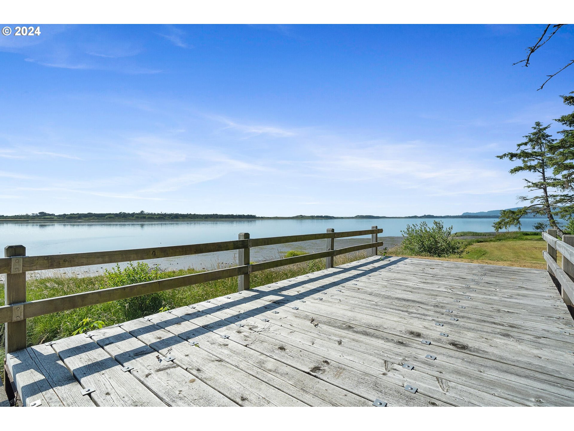 11250 Whiskey Creek Road Tillamook, OR 97141 - Photo 36 of 48 a view of ocean with a building in the background