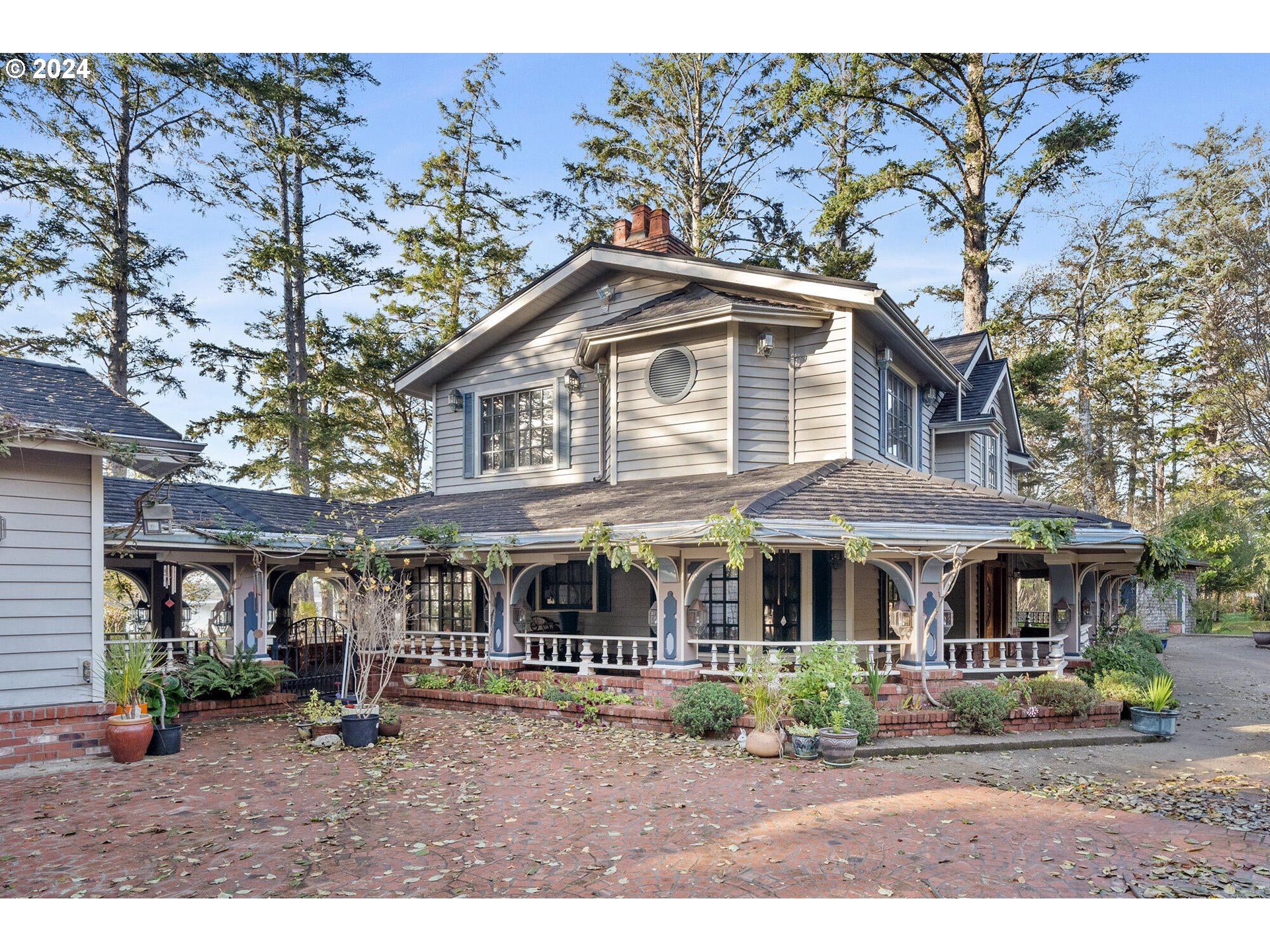11250 Whiskey Creek Road Tillamook, OR 97141 - Photo 4 of 48 a front view of a house with garden