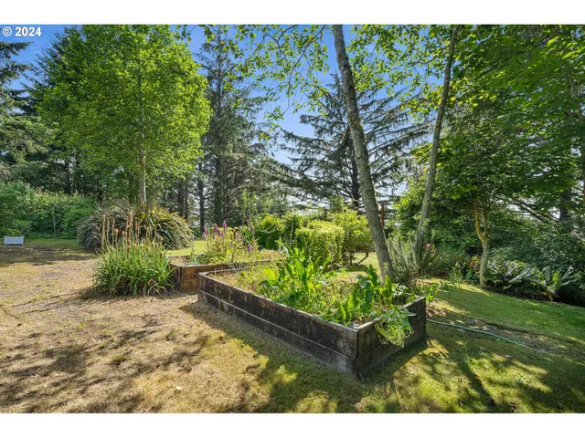 a view of a small garden in front of a house