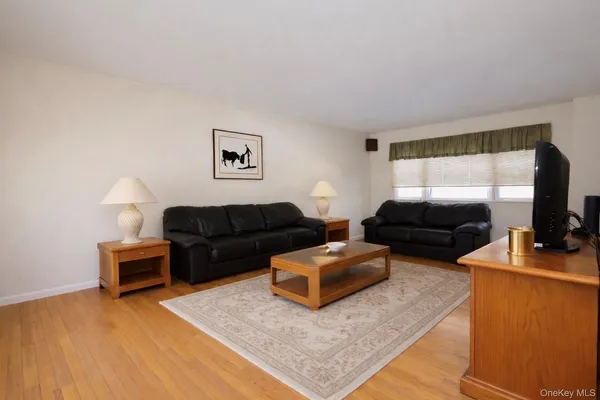 a kitchen with kitchen island granite countertop a sink stainless steel appliances and cabinets