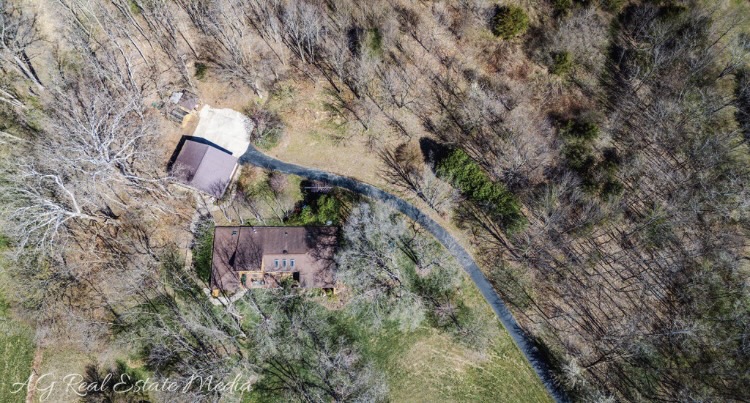2066 Tolbert Road Hamilton, OH 45011 - Photo 62 of 63 This secluded property features a winding driveway and ample green space, perfect for privacy and tranquility.