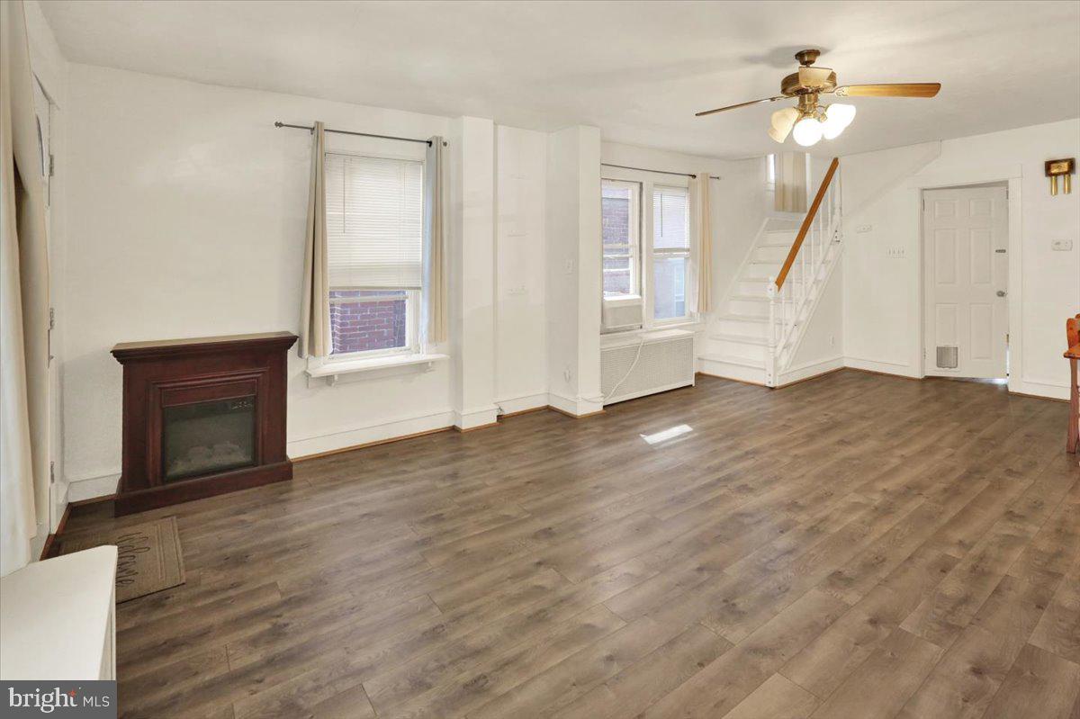 29 Arlington Street Reading, PA 19611 - Photo 6 of 32 a view of empty room with wooden floor and fan
